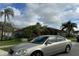 Silver Nissan Altima parked on a residential street at 2621 Rolling Broak Dr, Orlando, FL 32837