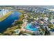 Aerial view of community amenities including pools and lake at 2746 Bookmark Dr, Kissimmee, FL 34746