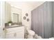 Clean bathroom with gray shower curtain and modern vanity at 2746 Bookmark Dr, Kissimmee, FL 34746