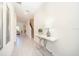 Bright and airy entryway with a stylish console table and mirror at 2746 Bookmark Dr, Kissimmee, FL 34746