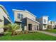 Modern two-story home with stone accents and landscaped lawn at 2746 Bookmark Dr, Kissimmee, FL 34746