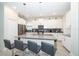 Spacious kitchen featuring modern white cabinets and a large island at 2746 Bookmark Dr, Kissimmee, FL 34746