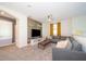 Spacious living room featuring a cozy sectional sofa and a modern TV at 2746 Bookmark Dr, Kissimmee, FL 34746
