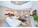 Open-concept living room with a large sectional sofa and adjacent kitchen at 2746 Bookmark Dr, Kissimmee, FL 34746