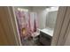 Bathroom with modern vanity, shower/tub combo, and neutral decor at 2973 Cool Breeze Cir, St Cloud, FL 34769