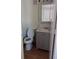 Clean bathroom with gray vanity and a mirrored medicine cabinet at 34429 Laralack Ave, Leesburg, FL 34788