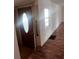 Home entry with wood-look floors and a glass-paned door at 34429 Laralack Ave, Leesburg, FL 34788