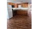 Kitchen with wood cabinets, granite counters, and stainless steel appliances at 34429 Laralack Ave, Leesburg, FL 34788