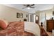 Main bedroom with king-size bed and ceiling fan at 4206 Sky Flower Ln, St Cloud, FL 34772