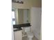 Bathroom with granite countertop, tub, and toilet at 4332 S Kirkman Rd # 1013, Orlando, FL 32811