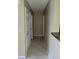 Clean hallway with tile flooring and access to bedrooms at 4332 S Kirkman Rd # 1013, Orlando, FL 32811