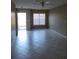 Living room with tile floors and access to backyard at 4332 S Kirkman Rd # 1013, Orlando, FL 32811
