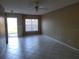 Living room with tile floors and access to backyard at 4332 S Kirkman Rd # 1013, Orlando, FL 32811