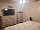 Bedroom featuring natural lighting, ceiling fan, and light wood furniture at 4749 Hopespring Dr, Orlando, FL 32829