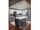 Updated kitchen with island seating, stainless steel appliances, and modern pendant lighting at 4749 Hopespring Dr, Orlando, FL 32829