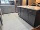 Modern kitchen featuring gray cabinets, white countertops and stainless steel appliances at 4749 Hopespring Dr, Orlando, FL 32829