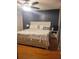 Comfortable main bedroom with a ceiling fan and soft, natural lighting at 4749 Hopespring Dr, Orlando, FL 32829