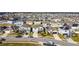 Aerial view of a residential neighborhood with many houses and solar panels at 583 Taft Dr, Davenport, FL 33837
