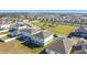 Aerial view of houses in a residential neighborhood with a park nearby at 583 Taft Dr, Davenport, FL 33837