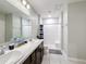 Bathroom with double vanity, shower, and tiled floor at 583 Taft Dr, Davenport, FL 33837