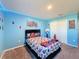 Blue bedroom with Spiderman theme, TV and window at 583 Taft Dr, Davenport, FL 33837
