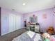 Bright bedroom with double doors and vanity at 583 Taft Dr, Davenport, FL 33837