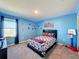 Blue bedroom with Spiderman theme, window and closet at 583 Taft Dr, Davenport, FL 33837