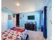 Blue bedroom with Spiderman theme, TV and window at 583 Taft Dr, Davenport, FL 33837