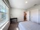 Bedroom with large window, desk, and access to another room at 583 Taft Dr, Davenport, FL 33837