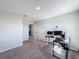Bright bedroom or office space with a desk and view into hallway at 583 Taft Dr, Davenport, FL 33837