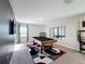Game room features a pool table, large mirror, and window with natural light at 583 Taft Dr, Davenport, FL 33837
