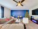 Bright living room showcasing a cozy sectional sofa and Christmas tree at 583 Taft Dr, Davenport, FL 33837