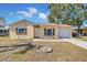 One-story house with a white door and garage at 614 Lavon Ct, Kissimmee, FL 34741