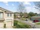 Aerial view of townhome community with street and parking at 7137 Harmony Square Dr # 31A, Harmony, FL 34773