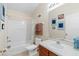 Clean bathroom with tub, toilet and vanity at 7137 Harmony Square Dr # 31A, Harmony, FL 34773