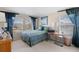 Bedroom with a double bed, a desk, and ample natural light at 7137 Harmony Square Dr # 31A, Harmony, FL 34773