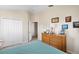 Bedroom with double door closet and dresser at 7137 Harmony Square Dr # 31A, Harmony, FL 34773
