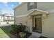 Green front door entrance with landscaping and walkway at 7137 Harmony Square Dr # 31A, Harmony, FL 34773