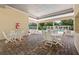 Relaxing pool area with covered seating and tables at 7137 Harmony Square Dr # 31A, Harmony, FL 34773
