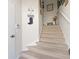 Staircase with carpeted steps leading to upper level at 7137 Harmony Square Dr # 31A, Harmony, FL 34773