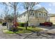 Tan three-story townhouse with a two-car garage at 7137 Harmony Square Dr # 31A, Harmony, FL 34773