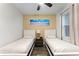 Bedroom with two twin beds and ceiling fan at 8178 Coconut Pl, Kissimmee, FL 34747