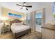 Bright bedroom with wood flooring and ceiling fan at 8178 Coconut Pl, Kissimmee, FL 34747