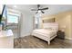 Main bedroom with ceiling fan and large window at 8178 Coconut Pl, Kissimmee, FL 34747
