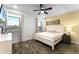 Main bedroom with ceiling fan and large window at 8178 Coconut Pl, Kissimmee, FL 34747