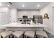 Contemporary kitchen boasting white cabinets, stainless steel appliances, and an island at 8178 Coconut Pl, Kissimmee, FL 34747