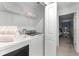 Laundry room with washer, dryer, and shelving at 8178 Coconut Pl, Kissimmee, FL 34747