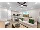 Open concept living area with comfortable seating, a coffee table, and kitchen views at 8178 Coconut Pl, Kissimmee, FL 34747