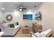 Relaxing living area with neutral-toned furniture and coastal-inspired artwork at 8178 Coconut Pl, Kissimmee, FL 34747