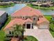 Luxury home with lake view, large yard, and tile roof at 880 Spinnaker Way, Kissimmee, FL 34746